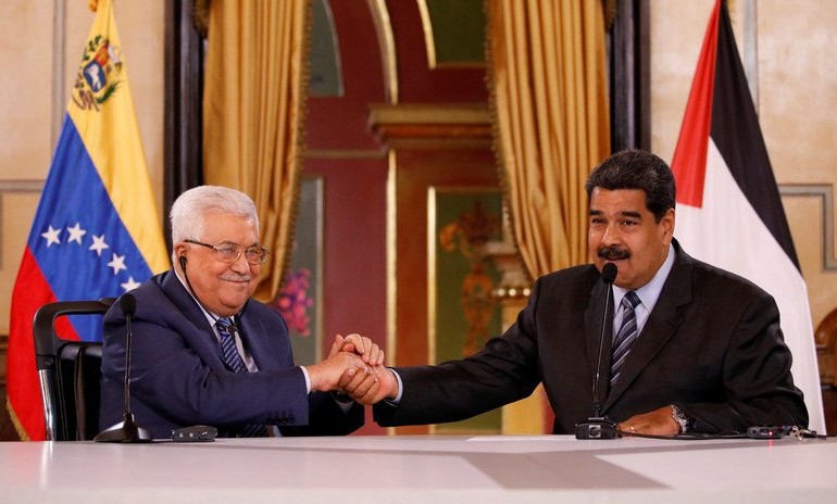 Venezuelan President and Palestinian President shake hands during a press release announcing the creation of a binational fund in Petro Credit: Carlos Garcia Rawlins / Reuters